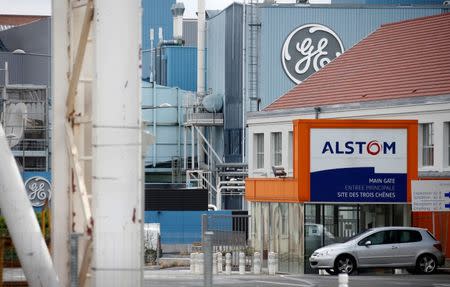 The logos of French power and transport engineering company Alstom and U.S. conglomerate General Electric are pictured on their site in Belfort, April 27, 2014. REUTERS/Vincent Kessler