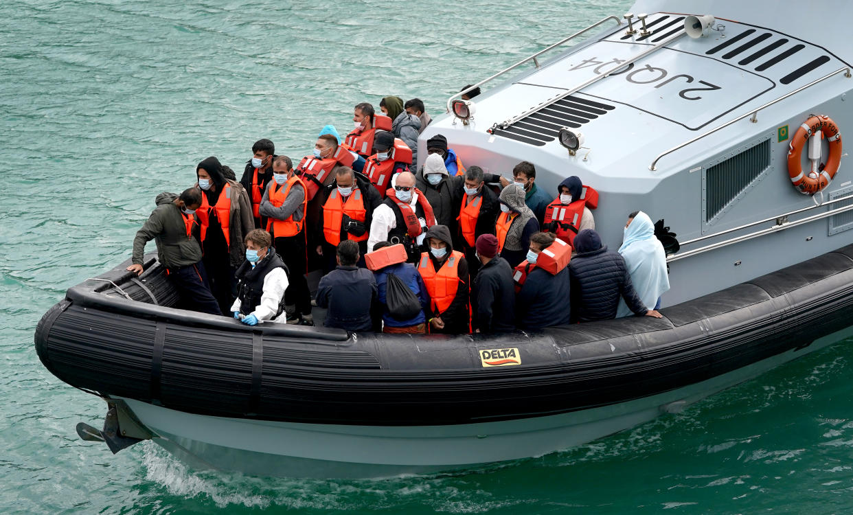 A group of people thought to be migrants are brought in to Dover, Kent, by Border Force officers, following a small boat incident in the Channel. Picture date: Sunday September 26, 2021. (Photo by Gareth Fuller/PA Images via Getty Images)