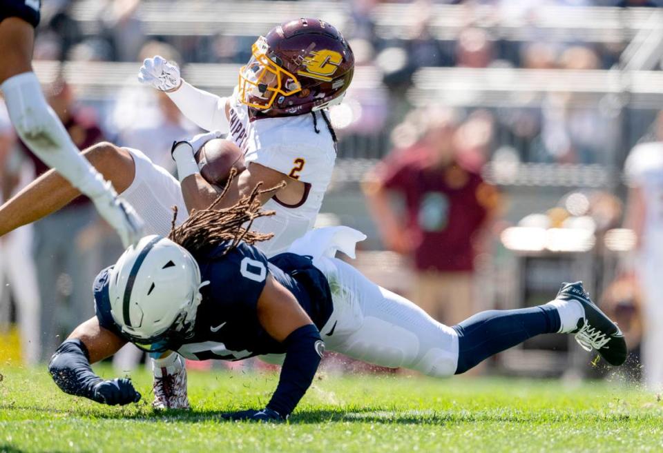 Penn State safety Jonathan Sutherland trips up Central Michigan’s Carlos Carriere during the game on Saturday, Sept. 24, 2022.