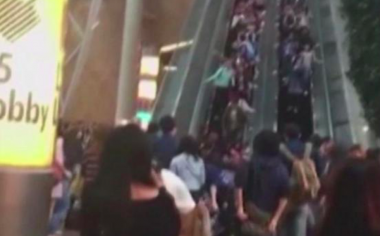 People fell to the base of the escalator after it reversed direction (Grab)