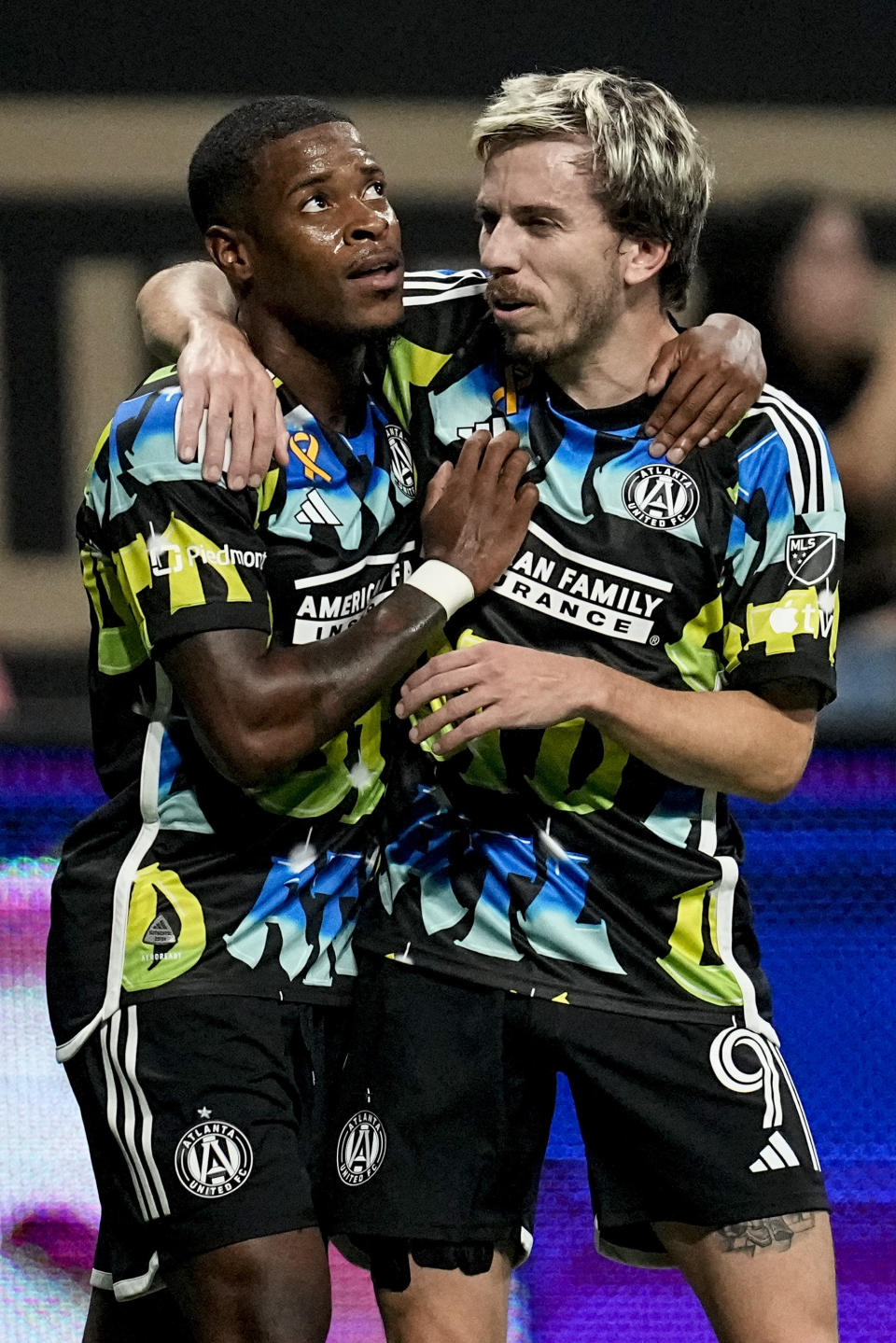 Atlanta United's Xande Silva (16) celebrates his goal with Saba Lobjanidze (9) during the first half of a MLS soccer match against CF Montréal, Saturday, Sept. 23, 2023, in Atlanta. (AP Photo/Mike Stewart)