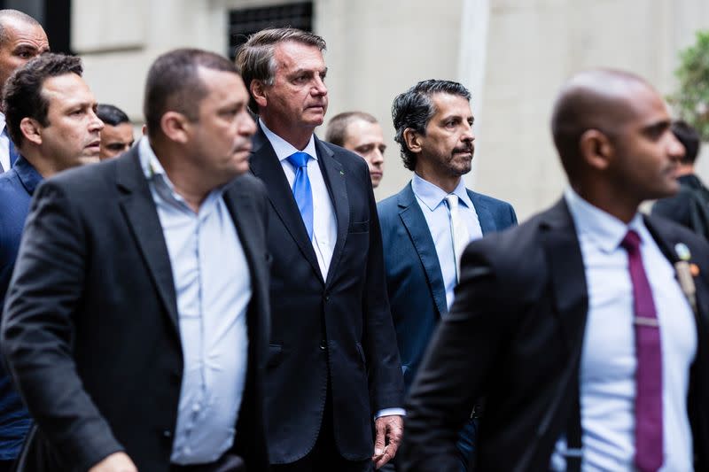 Brazil's President Jair Bolsonaro walks outside his hotel in New York