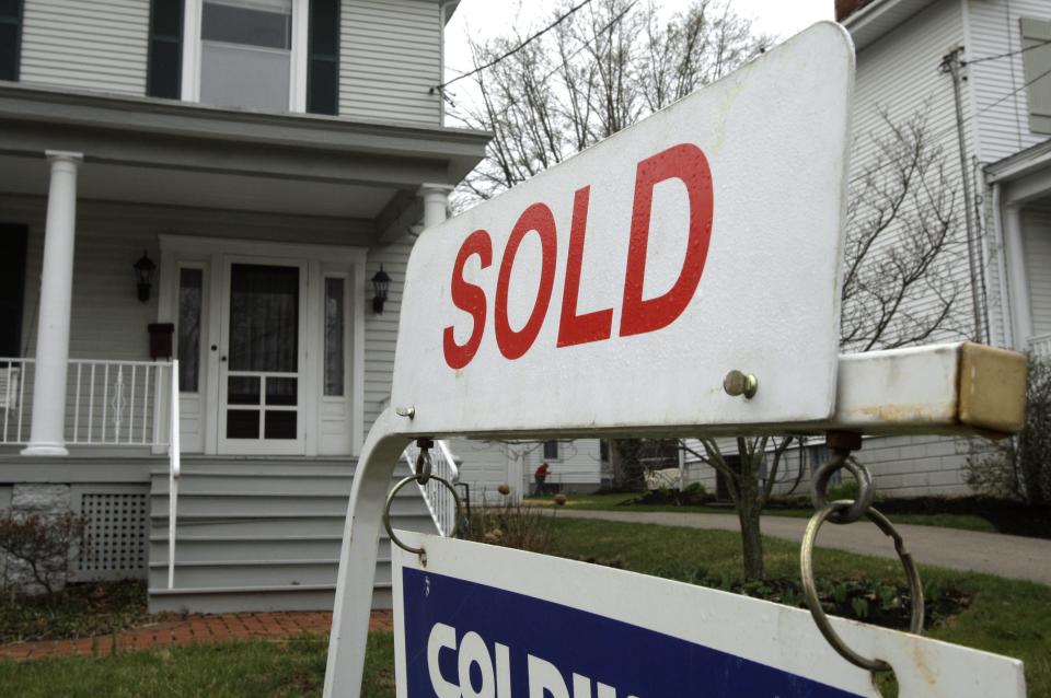 A sold sign is posted outside a home, Friday, March 27, 2009, in Cincinnati. A reader-submitted question about first-time home buyer credits is being answered as part of an Associated Press column called 