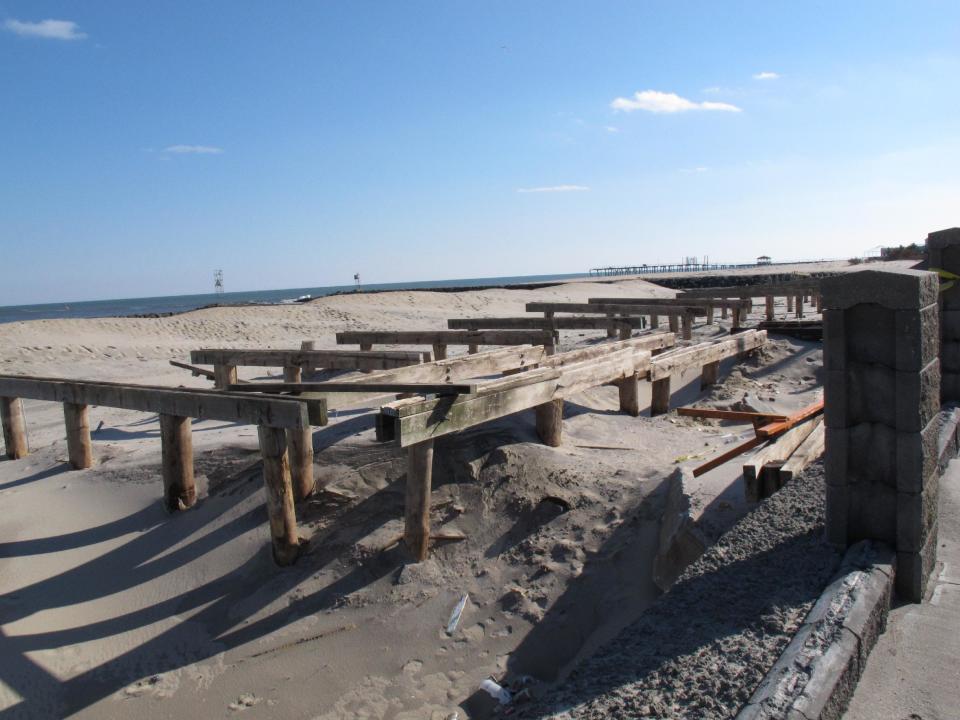 In this Feb. 12, 2013 photo, support pilings and damaged concrete are all that is left of the Avon, N.J. boardwalk, which was destroyed by Superstorm Sandy.Dogged by legal and environmental woes, Avon is lagging behind some other Jersey shore towns in terms of quickly rebuilding storm-damaged boardwalks. (AP Photo/Wayne Parry)