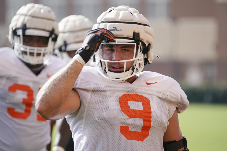 FILE - Oklahoma State's Brock Martin during an NCAA college football practice on Aug. 5, 2022, in Stillwater, Okla. Oklahoma State came within inches of winning the Big 12 title and likely claiming a spot in the College Football Playoff last season. The 12th-ranked Cowboys believe they can go further this season after a heartbreaking 21-16 loss to Baylor in the conference title game last December. (AP Photo/Sue Ogrocki, File)