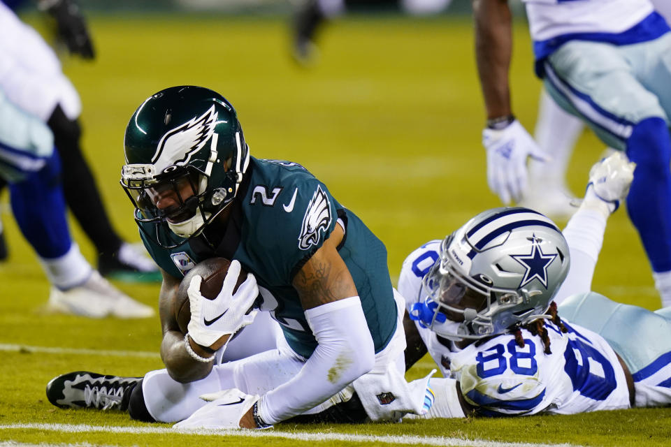 Philadelphia Eagles' Darius Slay intercepts a pass intended for Dallas Cowboys' Michael Gallup during the first half of an NFL football game Sunday, Oct. 16, 2022, in Philadelphia. (AP Photo/Chris Szagola)