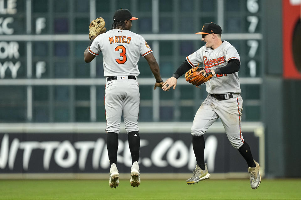 Baltimore Orioles' Jorge Mateo (3) and Austin Hays celebrate after a baseball game against the Houston Astros Tuesday, Sept. 19, 2023, in Houston. The Orioles won 9-5. (AP Photo/David J. Phillip)