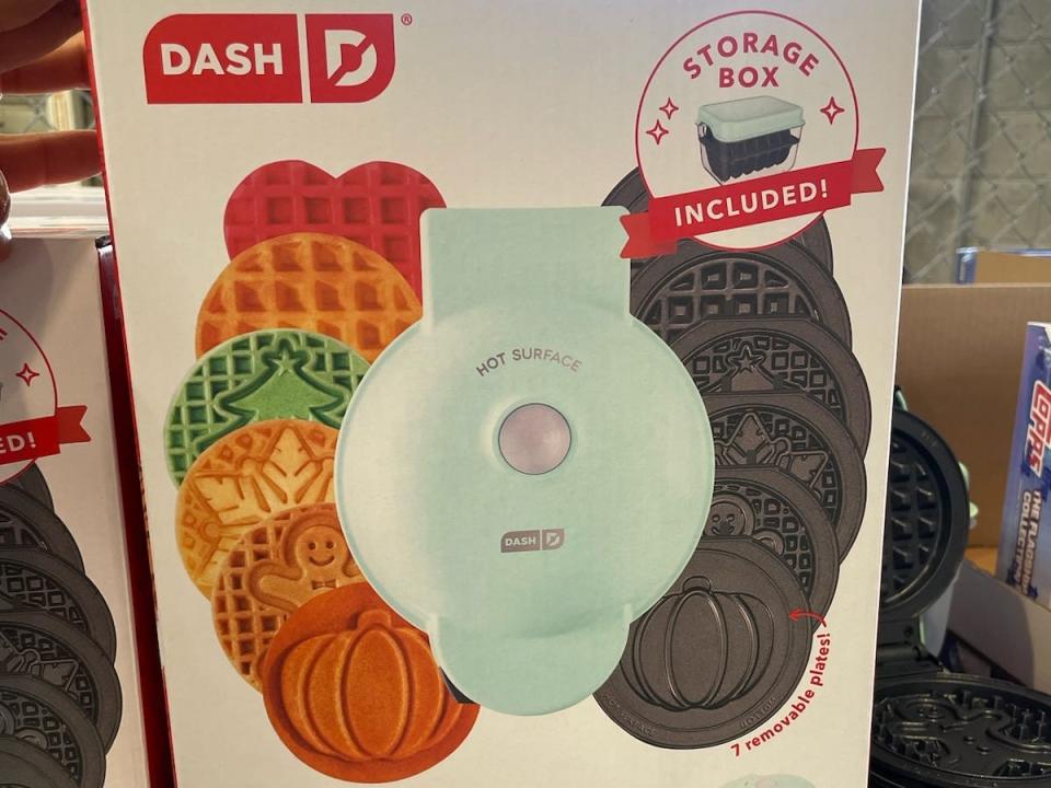 A box with images of waffles and waffle-maker plates containing the Dash mini maker at Costco