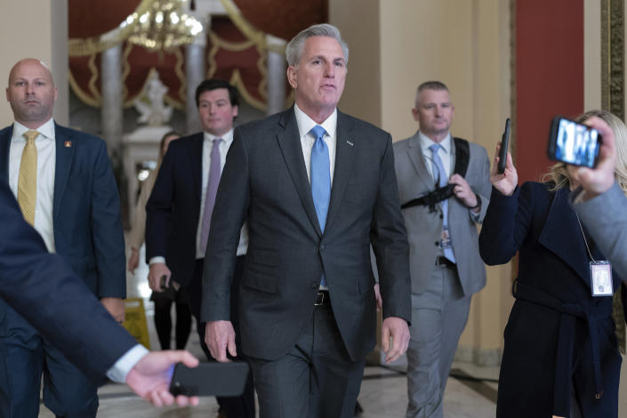Speaker of the House Kevin McCarthy, R-Calif., talks to reporters as he walks to the speaker's ceremonial office at the Capitol in Washington, Monday, Jan. 9, 2023. (AP Photo/Jose Luis Magana)
