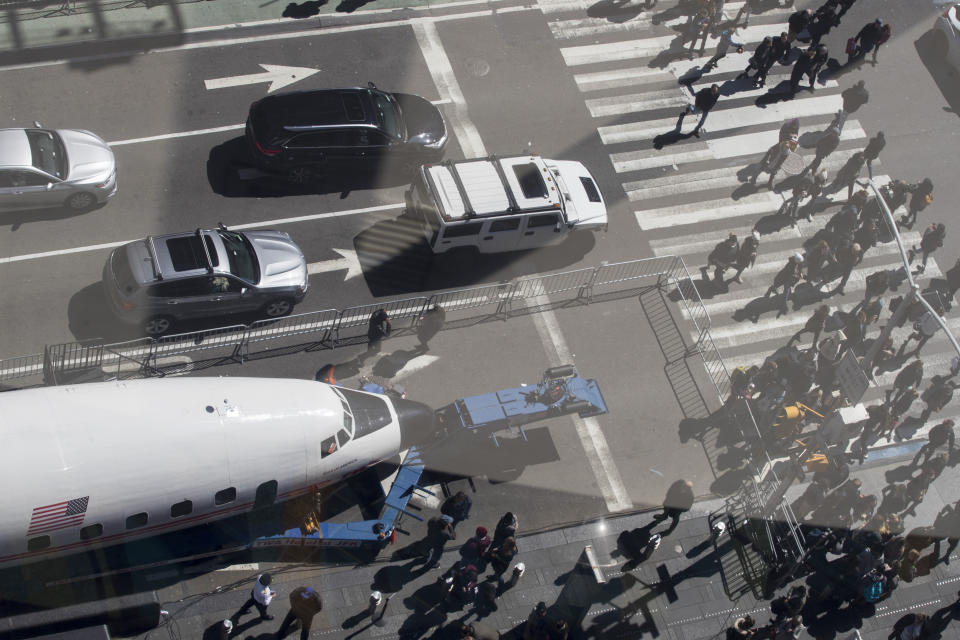 A Lockheed Constellation L-1649A Starliner, known as the "Connie, is parked in New York's Times Square during a promotional event, Saturday, March 23, 2019, in New York. The vintage commercial airplane will serve as the cocktail lounge outside the TWA Hotel at JFK airport. (AP Photo/Mary Altaffer)