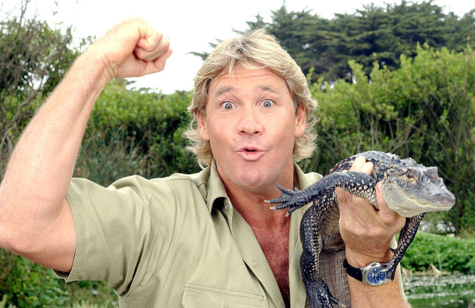 Steve Irwin holding a big lizard