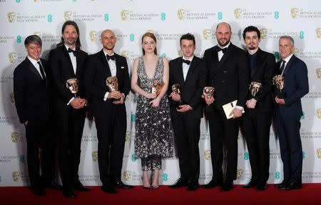 The team behind 'La La Land" hold their awards for Best Film at the British Academy of Film and Television Awards (BAFTA) at the Royal Albert Hall in London, Britain, February 12, 2017. REUTERS/Toby Melville