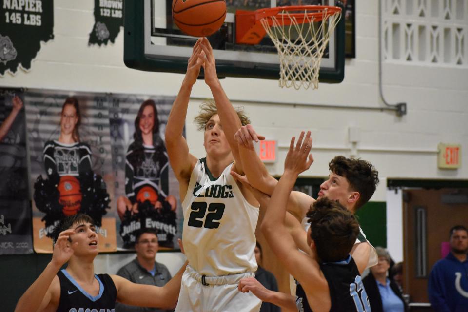 Monrovia senior Austin Leeds reaches for the ball off a pass inside as a herd of Cascade defenders swarm him during their game on Dec. 3, 2021.