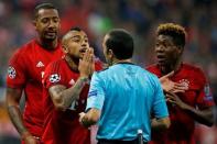 Britain Football Soccer - Bayern Munich v Atletico Madrid - UEFA Champions League Semi Final Second Leg - Allianz Arena, Munich - 3/5/16 Bayern Munich's Arturo Vidal reacts after referee Cuneyt Cakir awards a penalty to Atletico Madrid as Jerome Boateng and David Alaba look on Reuters / Michaela Rehle Livepic