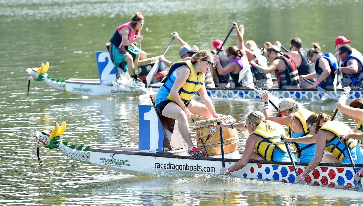 The NoccalulOARS (boat 2) compete against the Financial Avengers(boat 1) during the Habitat for Humanity Dragon Boat Festival Aug. 19, 2017, in Gadsden. Registration is underway for this year's event, set for Aug. 20.