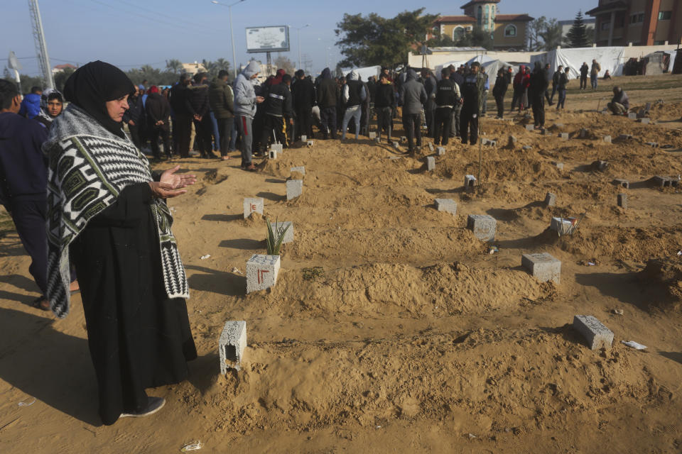 A Palestinian woman prays for a relative killed in the Israeli bombardment of the Gaza Strip in Khan Younis on Monday, Feb. 26, 2024. (AP Photo/Hatem Ali)