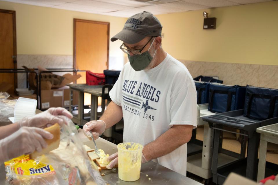Guy Wilde makes egg salad sandwiches to go out to Meals on Wheels clients at Central Bucks Senior Center in Doylestown on Tuesday, July 5, 2022. 