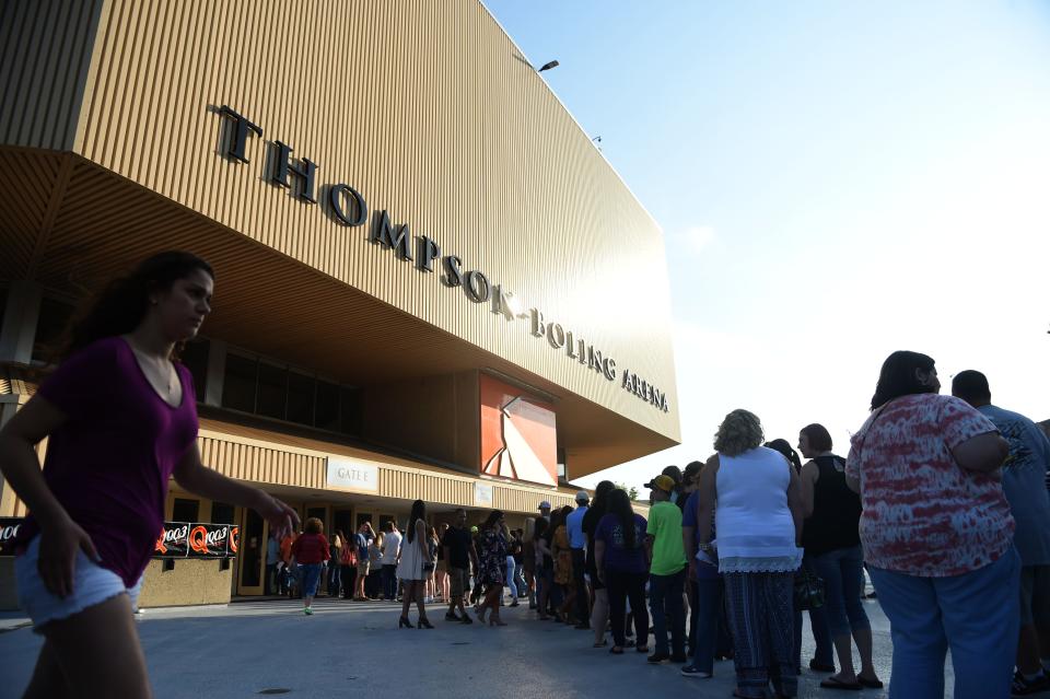 Florida Georgia Line fans line up outside Thompson-Boling Arena to see the country music duo perform April 29, 2017. Entrances on the north side of the arena would be pushed back from the venue's doors to adjacent parking lots so that people can purchase and consume beer throughout the outdoor concourse ramps, pictured here.