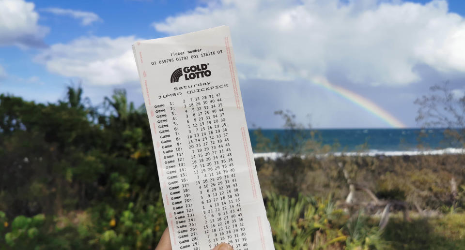 A lotto ticket in front of a rainbow