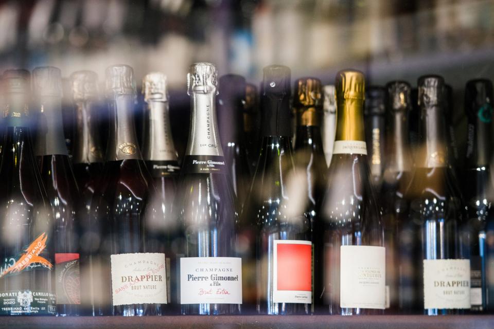 Bottles of champagne for sale at the La Cave Le Verre Vole wine store in Paris, France