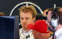 Formula One - Grand Prix of Austria - Spielberg, Austria - 2/7/16 - Mercedes Formula One driver Nico Rosberg of Germany and Mercedes represantative Niki Lauda after Rosberg crashing in training. REUTERS/Dominic Ebenbichler