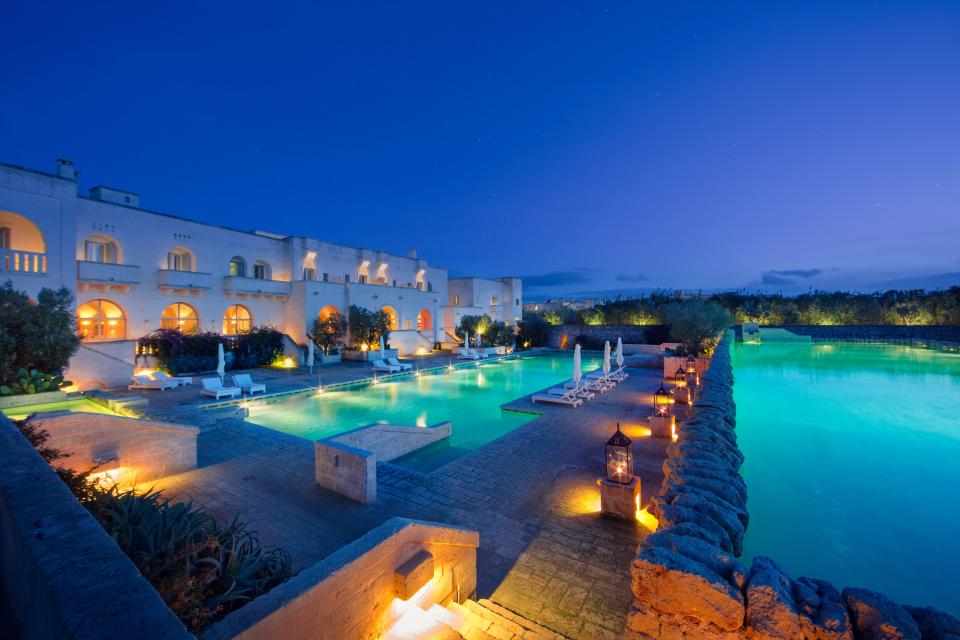 Two of the pools in the heart of Borgo Egnazia at dusk.