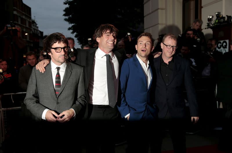 FILE PHOTO: Coxon, James, Albarn and Rowntree of the band Blur arrive for the GQ Men of the Year Awards at the Royal Opera House in London, Britain
