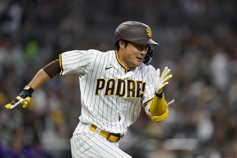 San Diego Padres' Ha-Seong Kim runs to first after hitting a single during the fourth inning of the team's baseball game against the Colorado Rockies, Friday, June 10, 2022, in San Diego. Kim was tagged out trying to advance to second base on the play. (AP Photo/Gregory Bull)