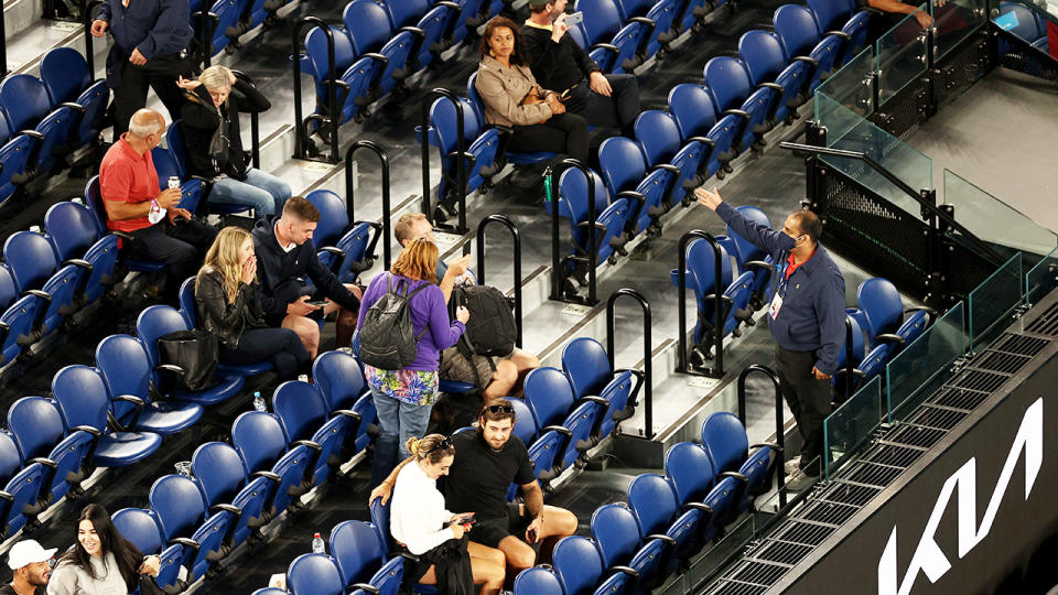 Australian Open staff and security, pictured here asking fans to leave. 