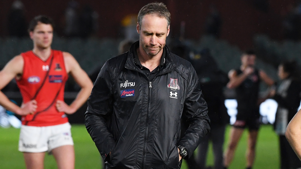 Essendon coach Ben Rutten (pictured middle) has remained as coach of the Bombers, despite a number of board meetings. (Getty Images)