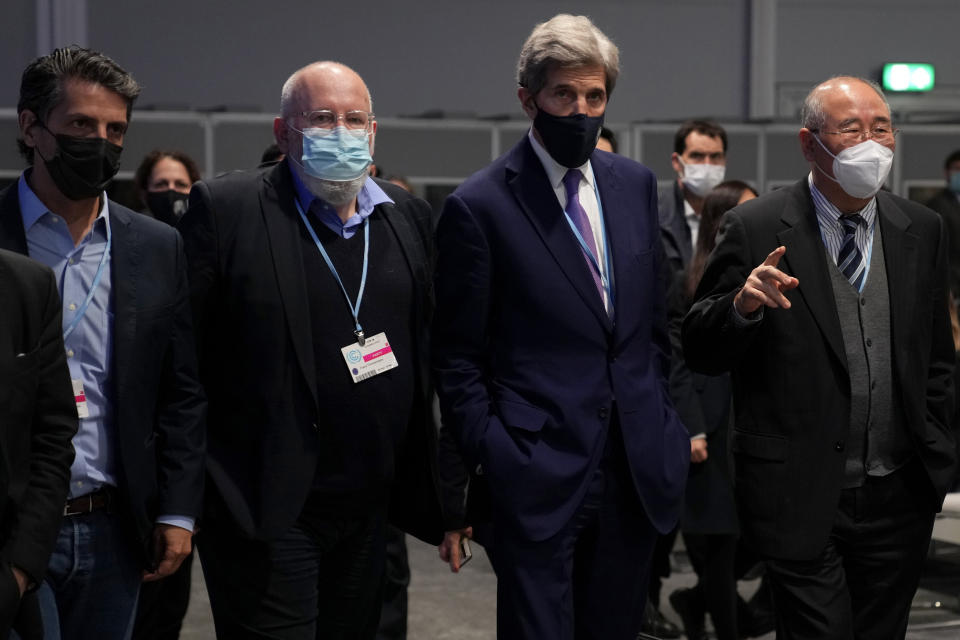 FILE - John Kerry, second right, United States Special Presidential Envoy for Climate walks with, from left, Brazil's Minister of the Environment Joaquim Alvaro Pereira Leite, European Commissioner for European Green Deal Frans Timmermans and China's Special Envoy for Climate Change and Chief Negotiator Xie Zhenhua before the closing plenary session at the COP26 U.N. Climate Summit, in Glasgow, Scotland, Saturday, Nov. 13, 2021. (AP Photo/Alastair Grant, File)