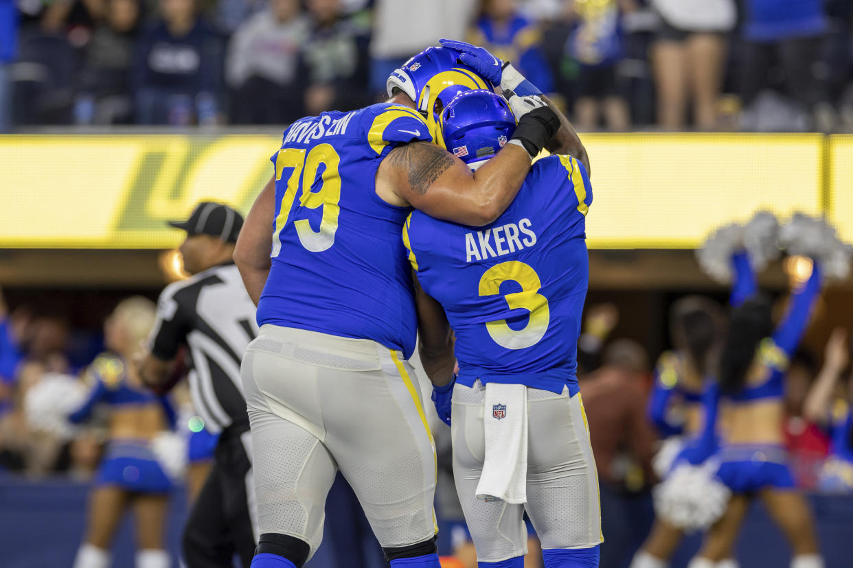 Los Angeles Rams Tackle Rob Havenstein (79) hugs running back Cam Akers (3) after Akers scored a touchdown last week. (AP Photo/Jeff Lewis)