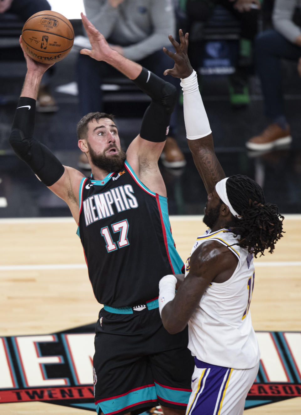 Memphis Grizzlies center Jonas Valanciunas (17) shoots over Los Angeles Lakers forward Montrezl Harrell (15) during the first half of an NBA basketball game Sunday, Jan. 3, 2021, in Memphis, Tenn. (AP Photo/Wade Payne)