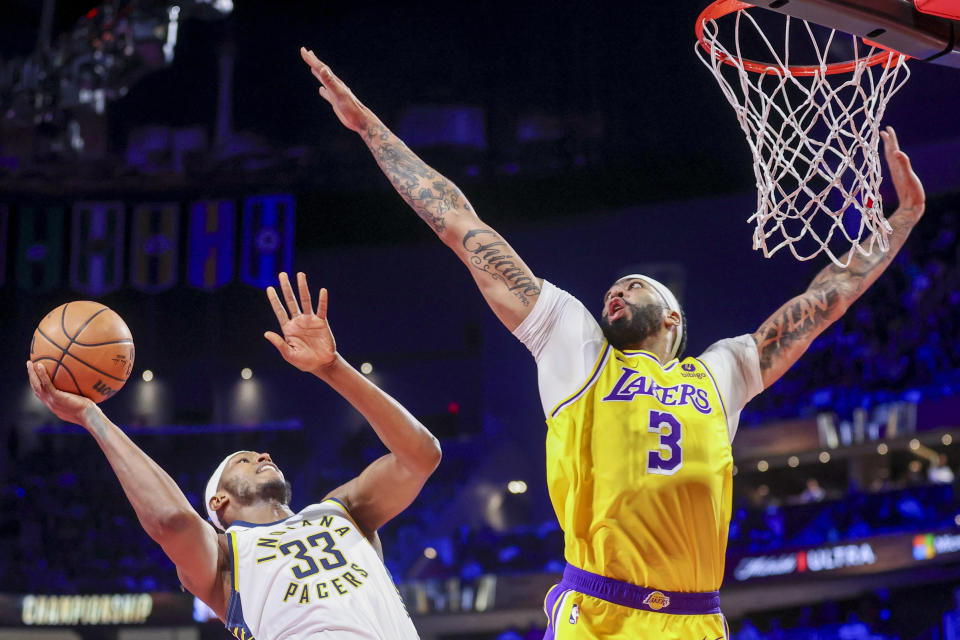 Indiana Pacers center Myles Turner (33) shoots over Los Angeles Lakers forward Anthony Davis (3) during the first half of the championship game in the NBA basketball In-Season Tournament Saturday, Dec. 9, 2023, in Las Vegas. (AP Photo/Ian Maule)