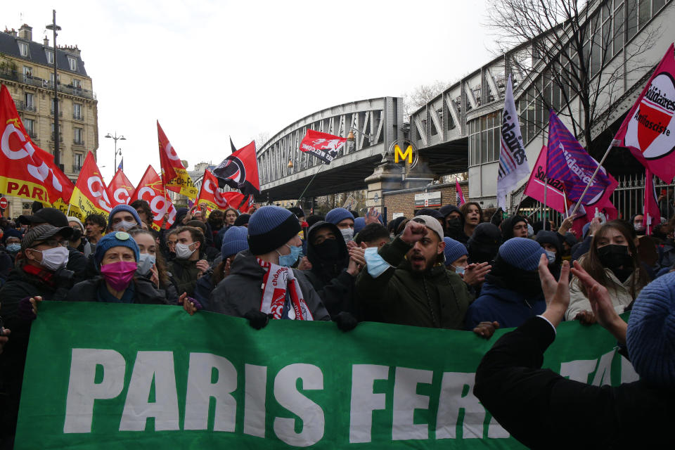 Protesters march during a demonstration against French presidential candidate Eric Zemmour, Sunday, Dec. 5, 2021 in Paris. French far right presidential candidate Eric Zemmour holds his first campaign rally in Villepinte, north of Paris. A first round is to be held on April, 10, 2022 and should no candidate win a majority of the vote in the first round, a runoff will be held between the top two candidates on April 24, 2022. (AP Photo/Michel Spingler)