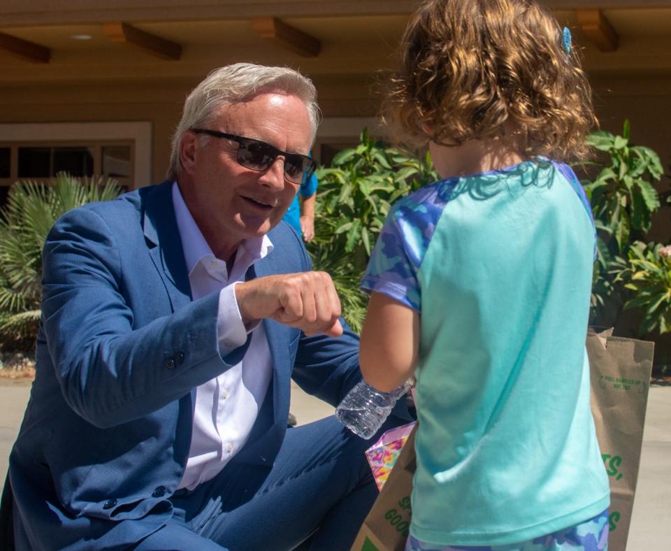 Outgoing Desert Sands superintendent Scott Bailey interacts with a young student on his last day of work in La Quinta, Calif., on June 30, 2022.