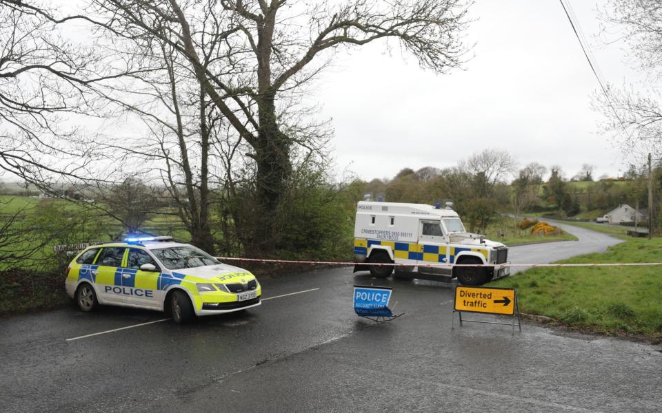 PSNI vehicles block a road during a security operation which has been ongoing since Monday on the Ballyquin Road - Niall Carson/PA Wire