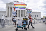 Demonstrators stand outside the Supreme Court on Thursday, June 27, 2024, in Washington. The Supreme Court cleared the way Thursday for Idaho hospitals to provide emergency abortions for now in a procedural ruling that left key questions unanswered and could mean the issue ends up before the conservative-majority court again soon. (AP Photo/Mark Schiefelbein)