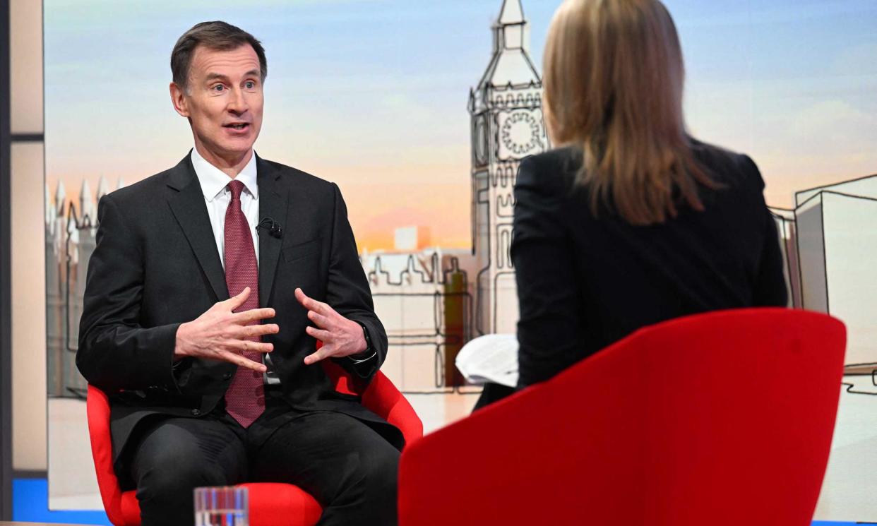 <span>Jeremy Hunt told BBC's Kuenssberg on Sunday that ‘even on those higher salaries, people are feeling under pressure’.</span><span>Photograph: Jeff Overs/BBC/AFP/Getty Images</span>