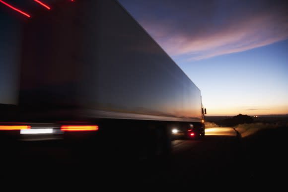 a truck driving toward the horizon