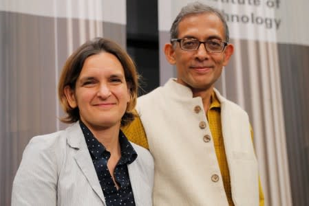 Banerjee and Duflo, two of the three winners of the 2019 Nobel Prize in Economics, stand together at MIT in Cambridge