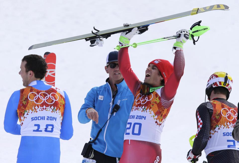 Men's supercombined winners, from left, Italy's Christof Innerhofer, bronze, Switzerland's Sandro Viletta, gold, and Croatia's Ivica Kostelic, silver, right, celebrate at the Sochi 2014 Winter Olympics, Friday, Feb. 14, 2014, in Krasnaya Polyana, Russia. (AP Photo/Gero Breloer)