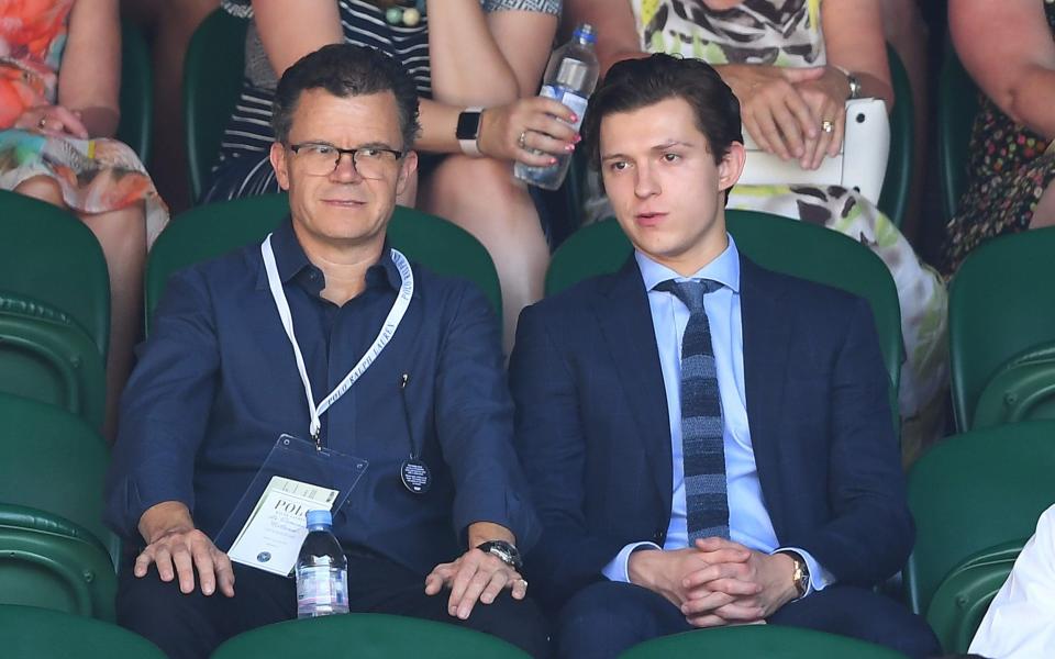 Holland with his son, Tom, at the Wimbledon Tennis Championships in 2018 - Getty