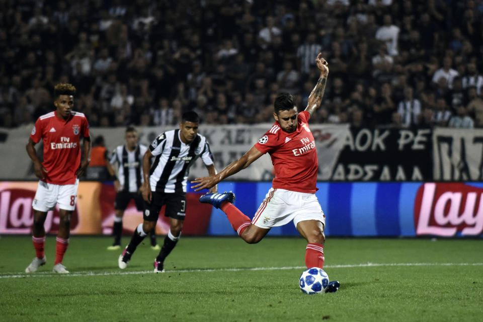 Benfica's Eduardo Salvio shoots to score a penalty and his side's second goal during the Champions League playoffs, second leg, soccer match between PAOK and Benfica at theToumba stadium in the northern Greek port city of Thessaloniki, on Wednesday, Aug. 29, 2018. (AP Photo/Giannis Papanikos)