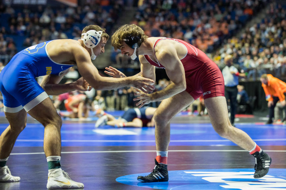 Rider's Ethan Laird (right), shown wrestling Hofstra's Trey Rogers in a first-round bout, has advanced to the NCAA Tournament quarterfinal.