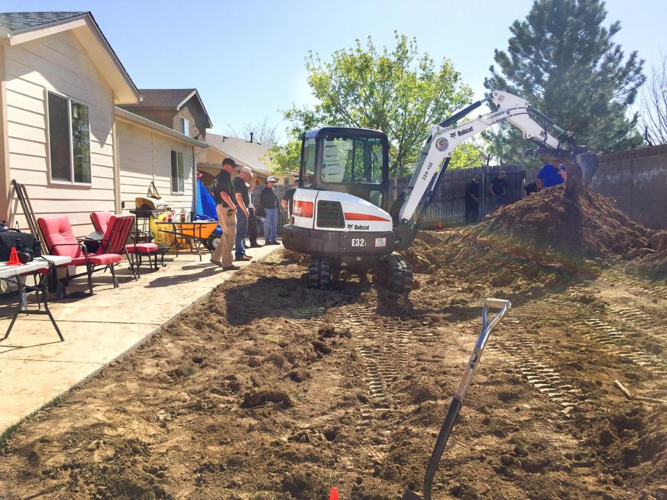 CHIEFTAIN PHOTO/FILE Law enforcement officials dig up the backyard of the former home of Donthe Lucas in April, during a two-day search for evidence in the disappearance of Kelsie Schelling.