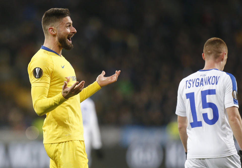 Chelsea's Olivier Giroud, left, celebrates after scoring his side's second goal during the Europa League round of 16, second leg soccer match between Dynamo Kiev and Chelsea at the Olympiyskiy stadium in Kiev, Ukraine, Thursday, March 14, 2019. (AP Photo/Efrem Lukatsky)