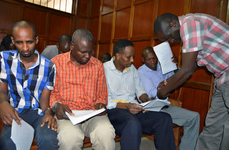 Suspects (L-R) Osman Ibrahim, Oliver Muthee, Guled Abdihakim and Joel Nganga sit inside the Mililani Law Courts where they appeared in connection with the attack at the DusitD2 complex, in Nairobi, Kenya January 18, 2019. REUTERS/Stringer