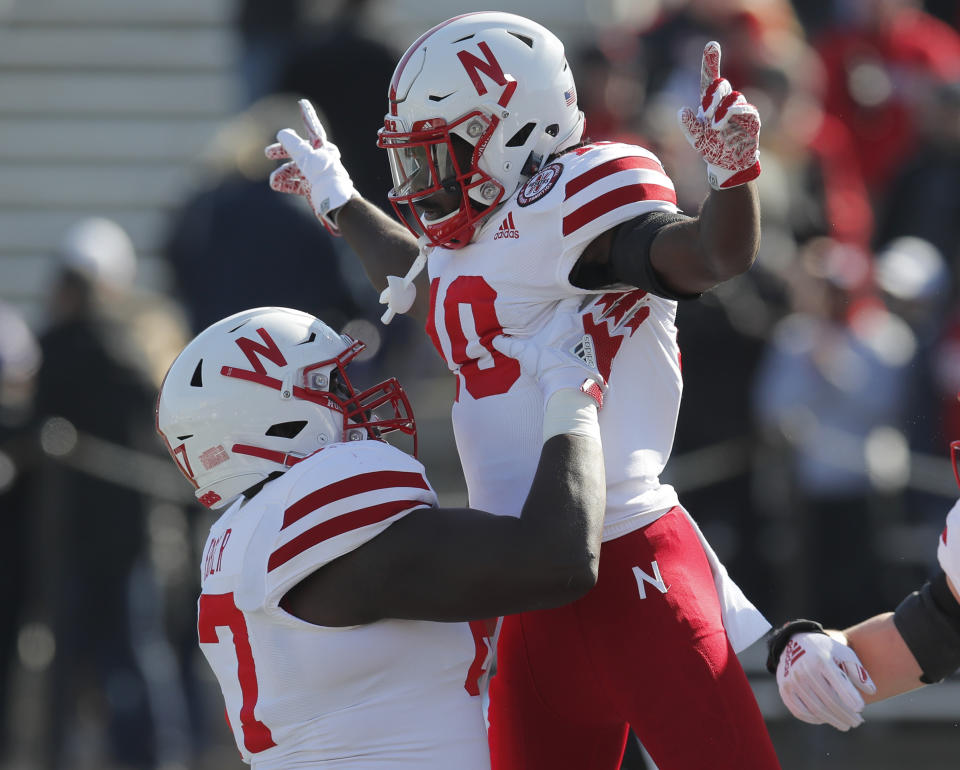 Nebraska's JD Spielman, right, celebrates with teammate Jerald Foster after scoring a touchdown against Northwestern during the first half of an NCAA college football game Saturday, Oct. 13, 2018, in Evanston, Ill.. (AP Photo/Jim Young)