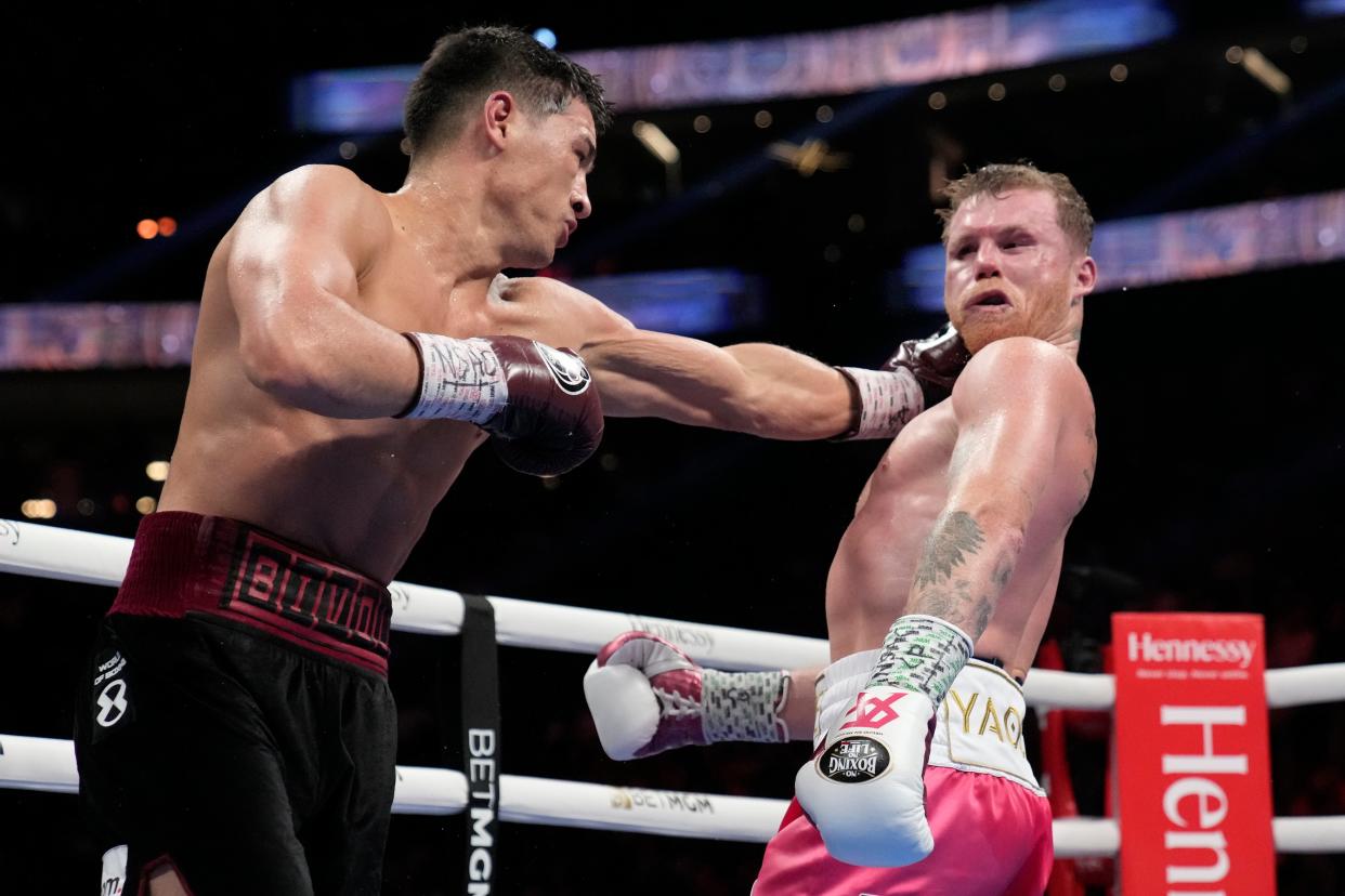 Dmitry Bivol (left) during his career-defining win over Canelo last year (Copyright 2022 The Associated Press. All rights reserved.)